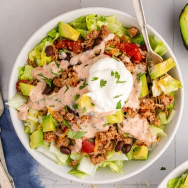 square image of turkey taco salad in a bowl with a fork
