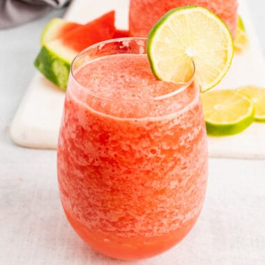 square image of a watermelon mosacto wine slushie in a stemless wine glass