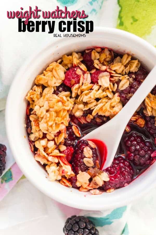 Weight Watchers Berry Crisp in a serving bowl with a spoon
