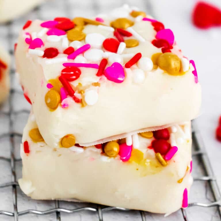 square image of two white chocolate fudge squares stacked up
