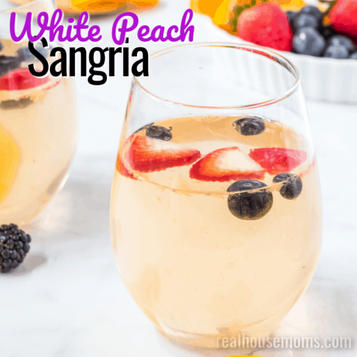 square image of white peach sangria with text