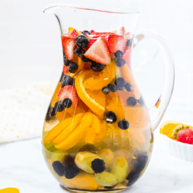 Whether you're lounging by the pool, entertaining friends, or just relaxing after work, you'll want this White Peach Sangria by your side!