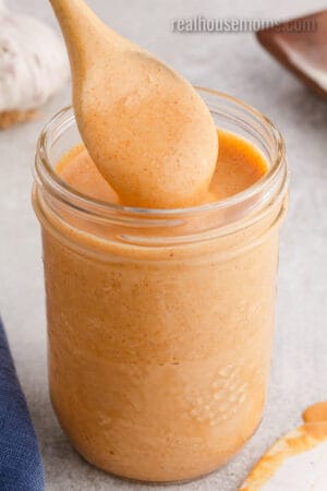 spoon of yum yum sauce over the jar