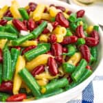 square image of three bean salad in a serving bowl