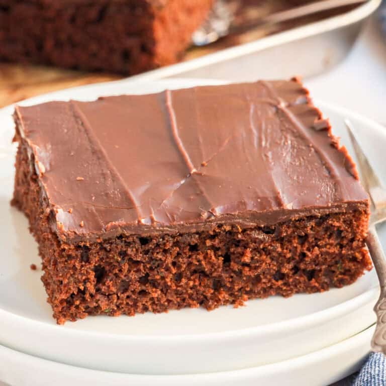 square image of a slive of zucchini texas sgeet cake
