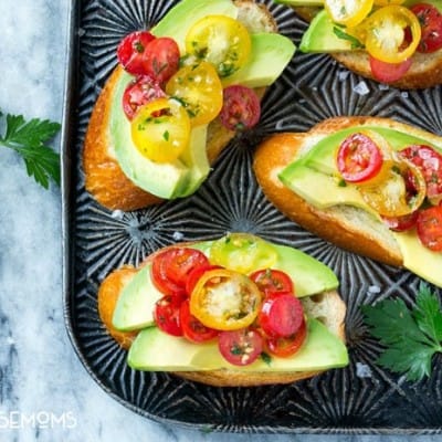 Avocado toast is not just for breakfast anymore! These AVOCADO CROSTINI are topped with a tomato and herb relish and are the perfect simple appetizer for any occasion!