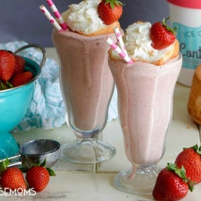 This BOOZY STRAWBERRY SHORTCAKE MILKSHAKE is EPIC!! Strawberries, Cake Vodka, and ACTUAL cake topped with more cake, whipped cream, and a strawberry! You can have your cake and drink it too!