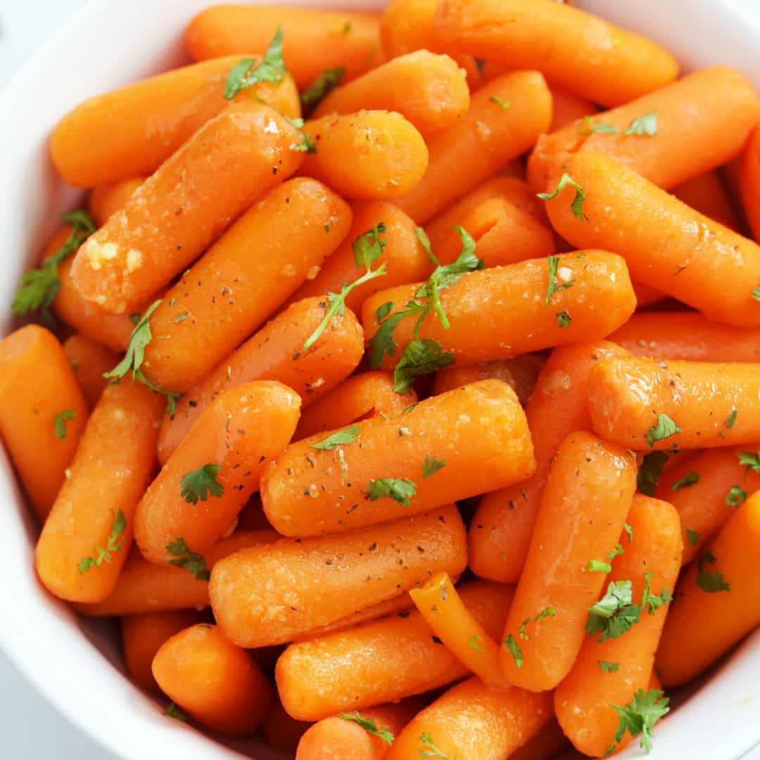 Tender baby carrots tossed in a rich brown butter & garlic herb sauce make for a simple, quick, and delicious side dish. These Brown Butter Carrots go with almost all your favorite meals!