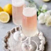 This Champagne Lemonade is the perfect light cocktail for your holiday parties! Serve it up at brunch, bridal showers, or New Year's Eve! It's easy to make too!