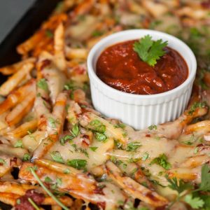 Cheesy Chipotle Fries smothered in a super spicy chipotle pepper sauce and melted Monterey Jack cheese make for a great finger food appetizer!