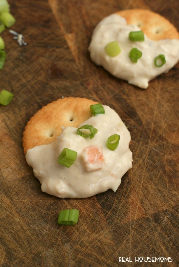 This cheesy CROCK POT SHRIMP AND ARTICHOKE DIP is hot, creamy, and full of tender shrimp. It's sure to be the hit of your next get-together!