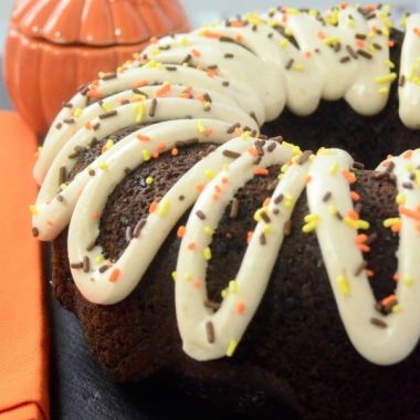 This Chocolate Bundt Cake with Pumpkin Spice Frosting, with its rich & decadent flavors, will be the star of your fall potluck!