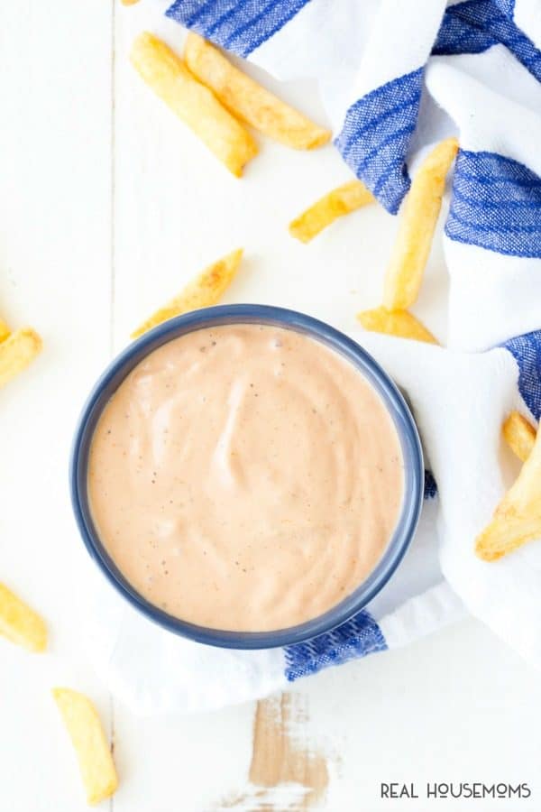 Overhead shot of fry sauce in a serving bowl with a few french fries along side