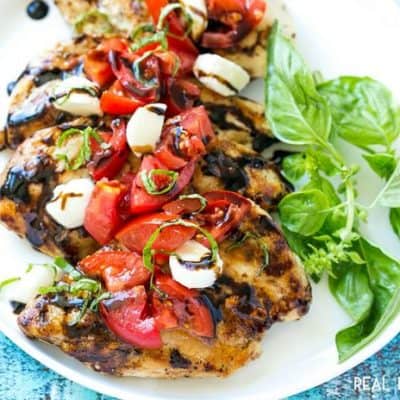 This GRILLED CAPRESE CHICKEN is the perfect way to showcase ripe summer tomatoes! It's an easy and flavorful dinner that's ready in 20 minutes!