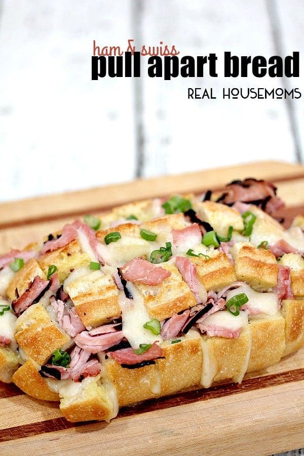 HAM AND SWISS PULL APART BREAD is made with cheesy, gooey Swiss cheese, Virginia ham, and takes less than 30 minutes to make. Perfect for noshing in a hurry!