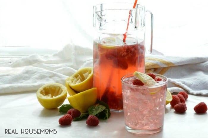 Toast to the warm summer months with this fun cocktail! HARD RASPBERRY LEMONADE is simple to make and great for serving a crowd of thirsty guests!