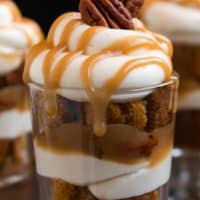 Dig into one of these heavenly MINI CARAMEL PECAN PUMPKIN TRIFLES layered with rich caramel, pecans, cheesecake filling, and pumpkin cake for fall dessert bliss!