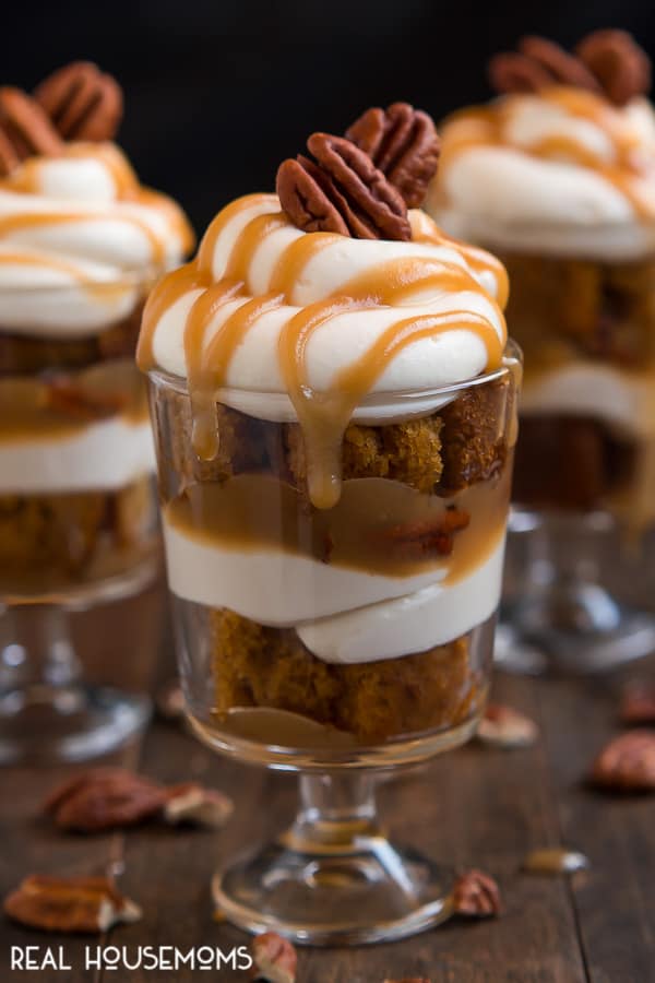Dig into one of these heavenly MINI CARAMEL PECAN PUMPKIN TRIFLES layered with rich caramel, pecans, cheesecake filling, and pumpkin cake for fall dessert bliss!