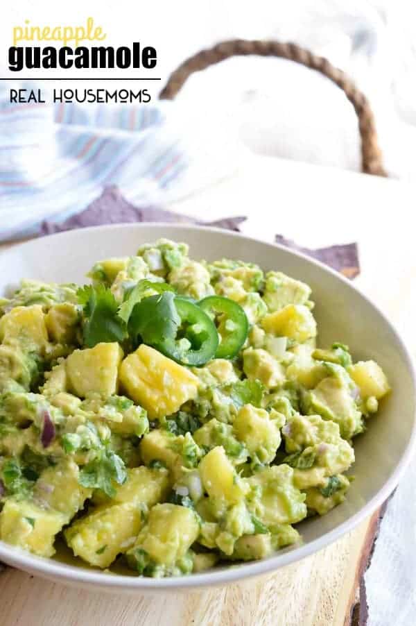 PINEAPPLE GUACAMOLE is a flavor combo that seems strange but works so well! Creamy avocado with sweet and tangy pineapple chunks makes the perfect summertime snack!