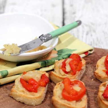 ROASTED GARLIC AND RED PEPPER BRUSCHETTA is the perfect appetizer. The flavors of nutty roasted garlic and red pepper burst in your mouth with every bite!