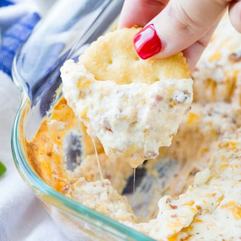 If you are looking for a great dip to make for your next get together, you need to try this Warm & Cheesy Crack Dip! It's super easy to make & so delicious!