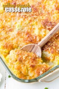 Squash casserole in a baking dish with a spoon
